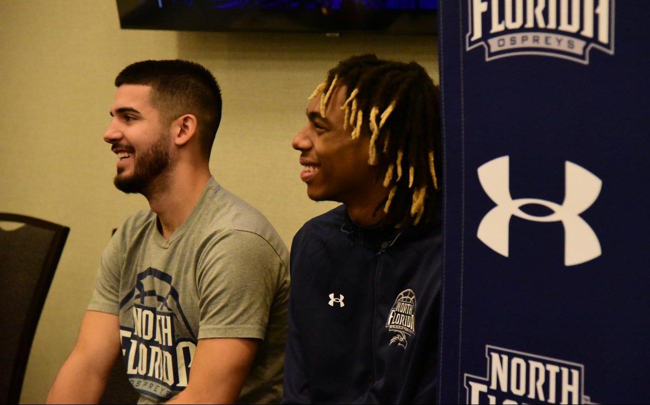 Basketball players smile in interaction with media