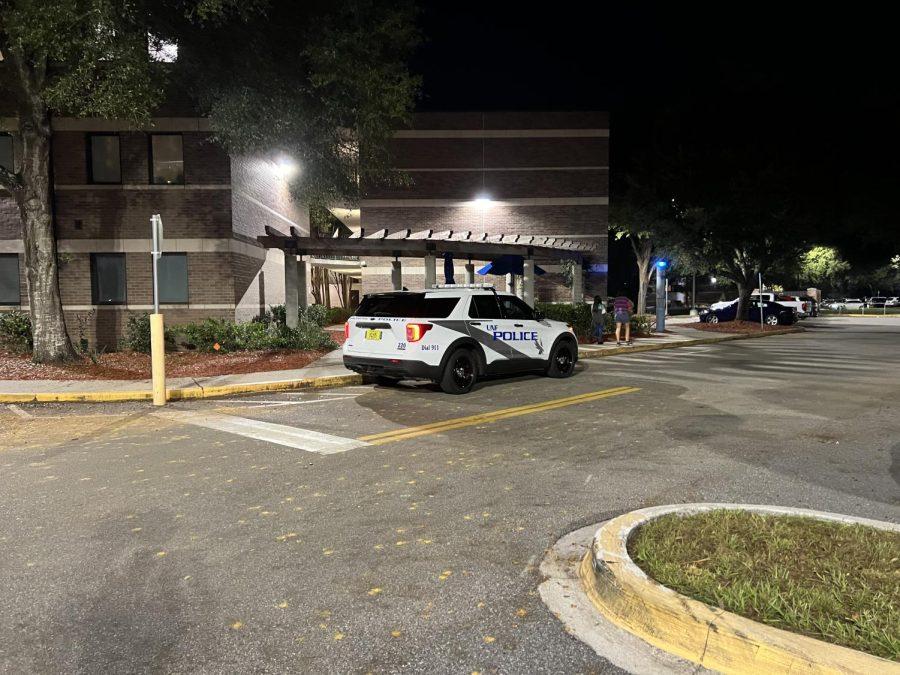 A University Police Department squad car outside the Osprey Cove dorms Tuesday night.