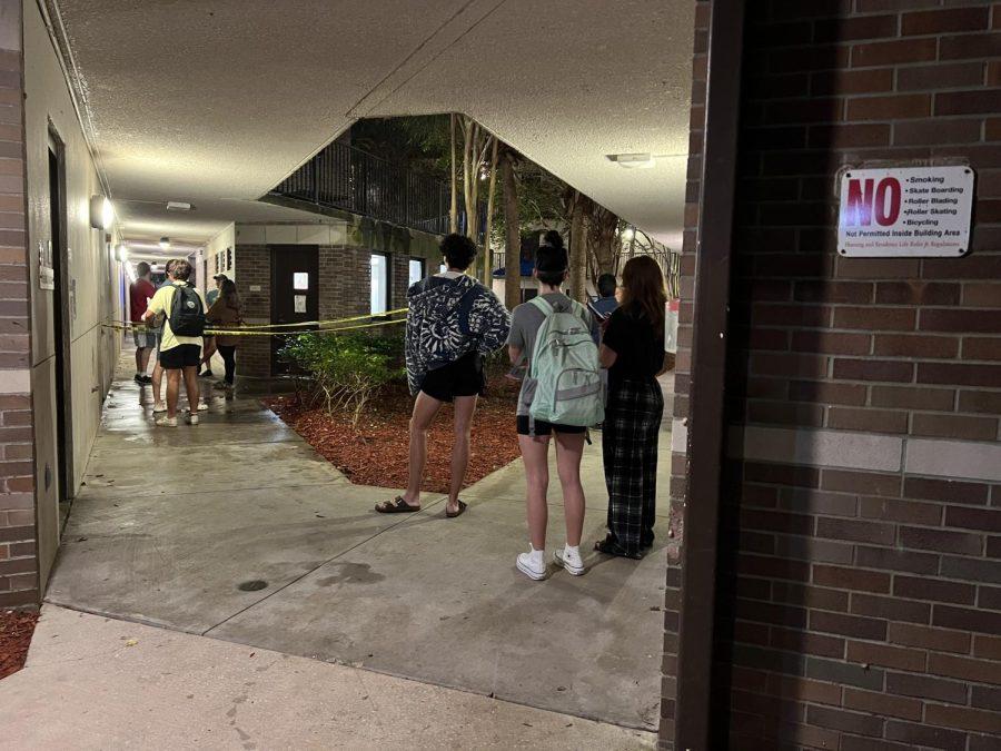 Students behind yellow caution tape
