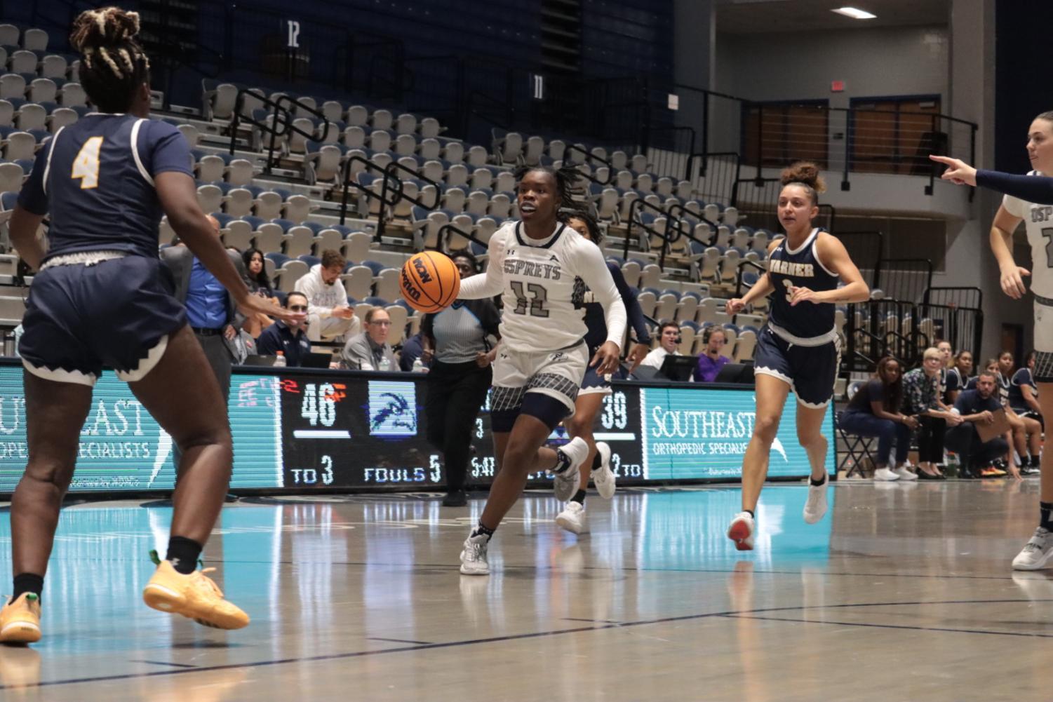 Kaila Rougier dribbles the ball