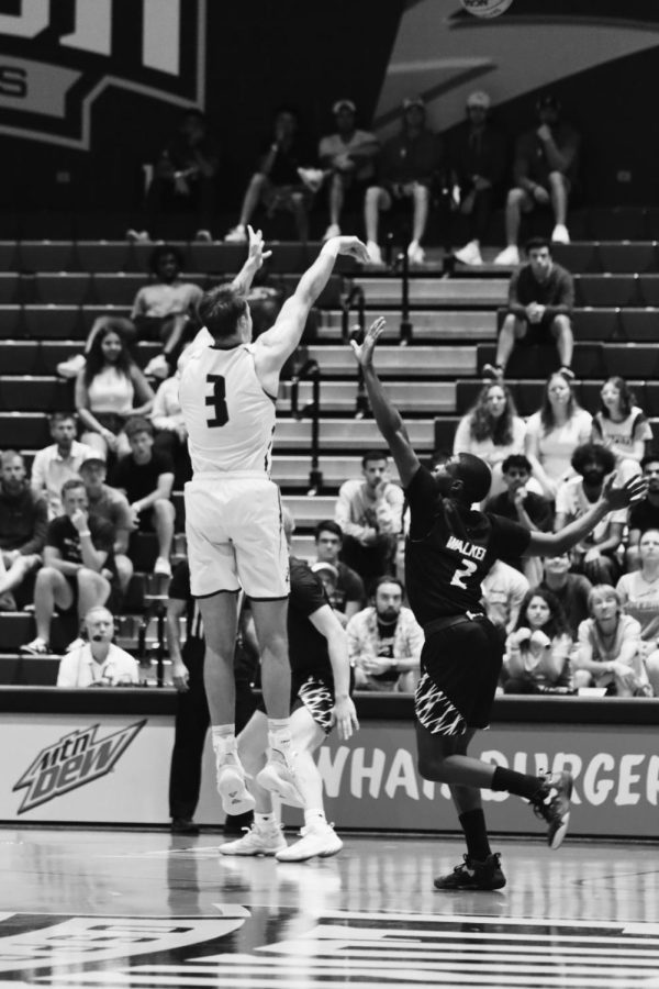 UNF Forward Carter Hendricksen #3 shoots a three against Eastern Kentucky on Feb. 22, 2023 at UNF Arena in Jacksonville, Florida.