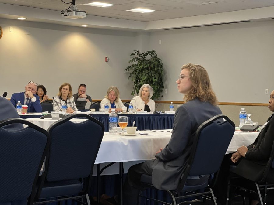 Nathaniel Rodefer, student body president and Board of Trustee member, listens to a speaker during their Monday meeting.