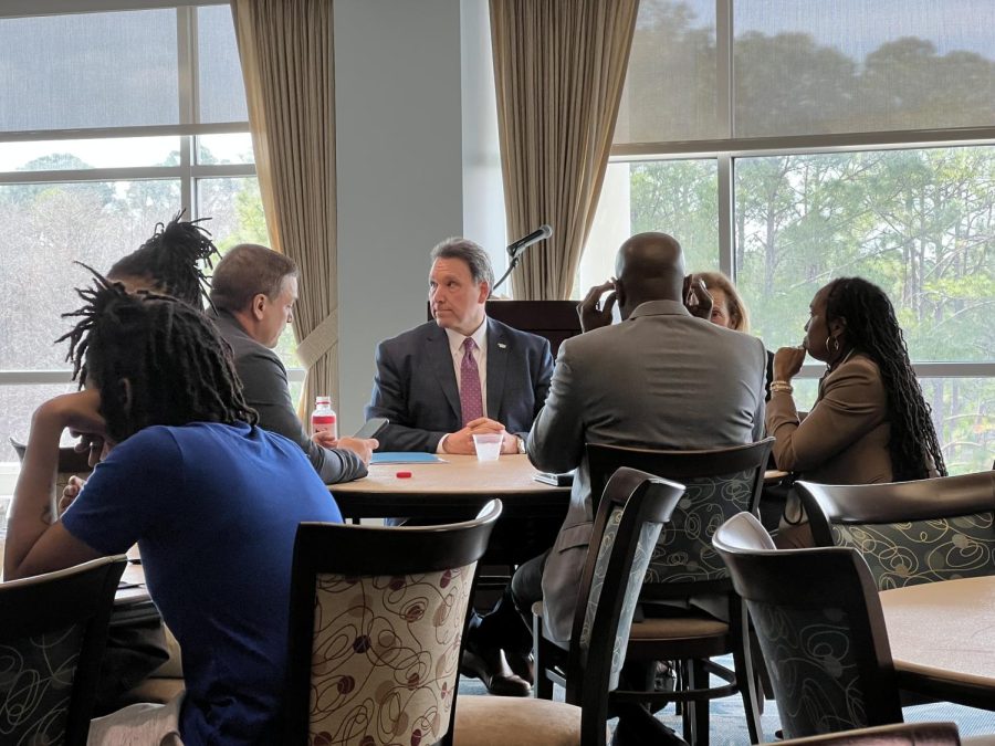President Moez Limayem prepares to speak to University of North Florida students during a town hall meeting on Feb. 23.