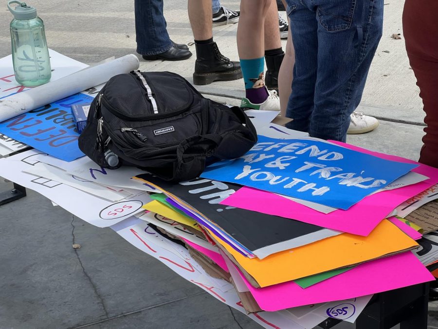 A stack of signs before the protest began. They would later be passed out to newcomers as they arrived.