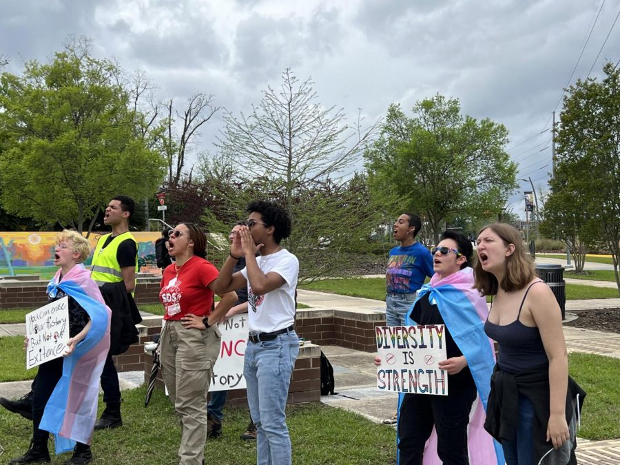 Members of Students for a Democratic Society's University of North Florida chapter yell during call and response chants on Tuesday.