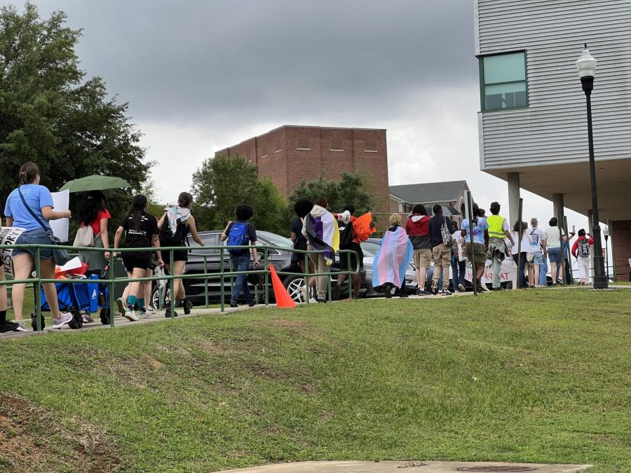Protesters walk across FAMU's campus on Tuesday.