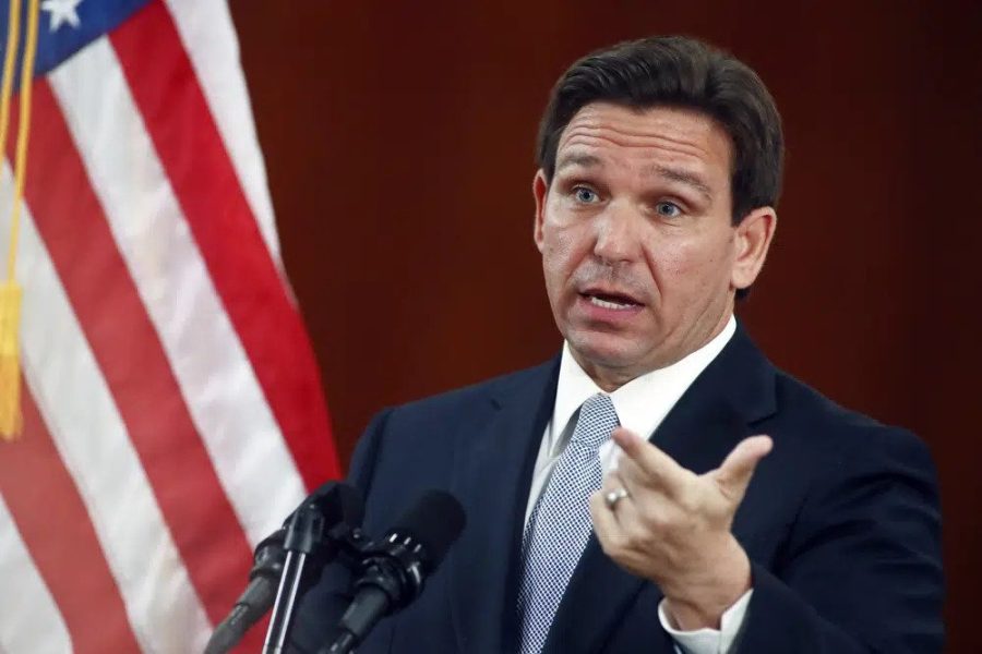 FILE - Florida Gov. Ron DeSantis answers questions from the media in the Florida Cabinet following his State of the State address during a joint session of the Senate and House of Representatives Tuesday, March 7, 2023, at the Capitol in Tallahassee, Fla. Advocates for open government are ringing alarms about plans by Florida Gov. Ron DeSantis' administration that could make it harder to learn what public officials are doing and to speak out against them. (AP Photo/Phil Sears, File)