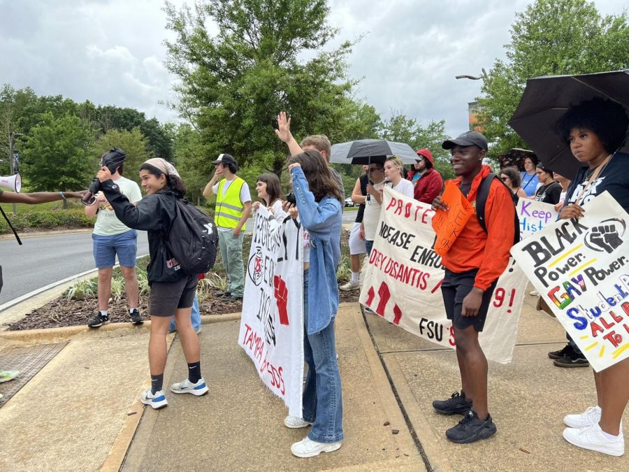 Protesters waved to cars that honked their horns in apparent support as they passed. 