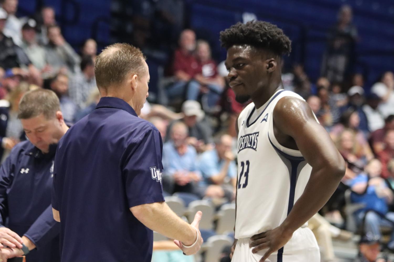 Driscoll speaks with Jah Nze during a game