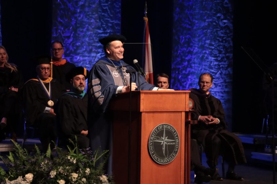 Limayem smiles on the podium during his speech. 