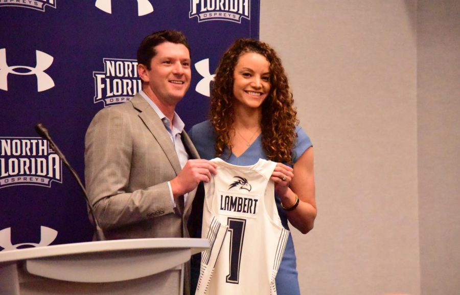 Morrow and Lambert pose with jersey in hand