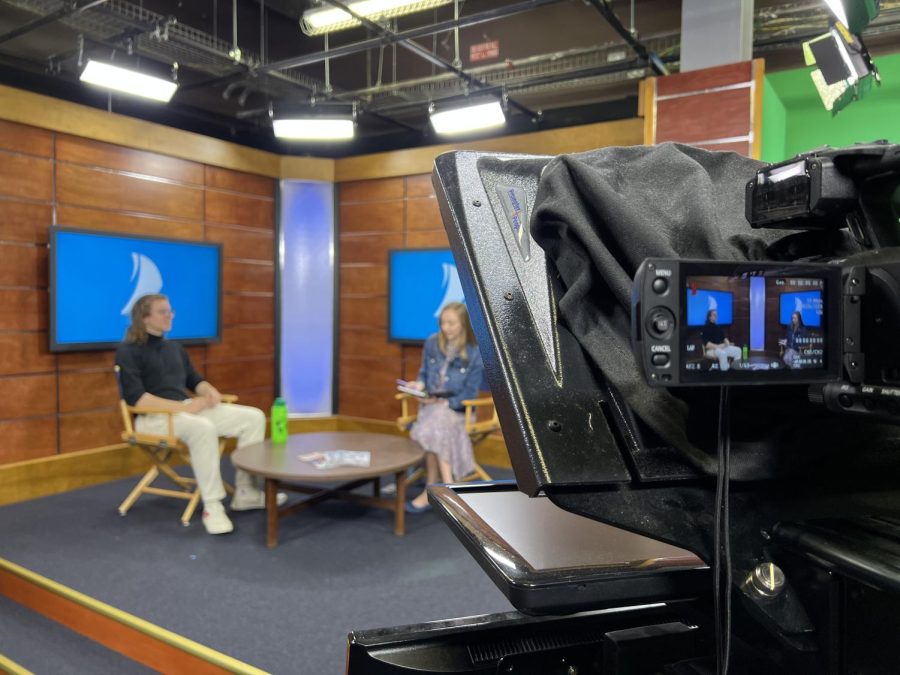 Nathaniel Rodefer (left) sits down in the Spinnaker TV studio for an interview with TV General Manager Kara Scarbrough (right) about his time as student body president.