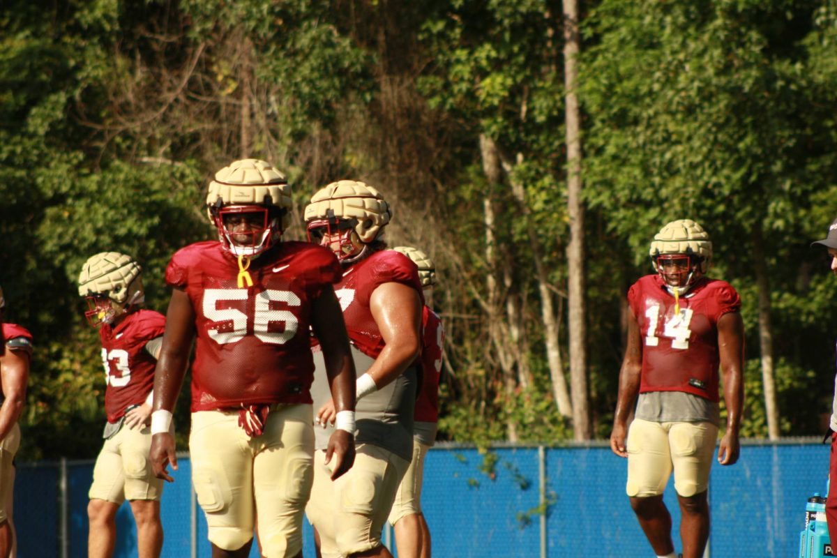 Linemen stand with each other.