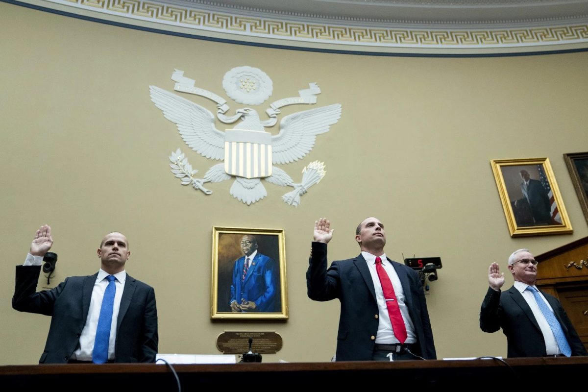 Ryan Graves, Americans for Safe Aerospace Executive Director, from left, U.S. Air Force (Ret.) Maj. David Grusch, and U.S. Navy (Ret.) Cmdr. David Fravor, are sworn in during a House Oversight and Accountability subcommittee hearing on UFOs, Wednesday, July 26, 2023, on Capitol Hill in Washington (AP Photo/Nathan Howard)