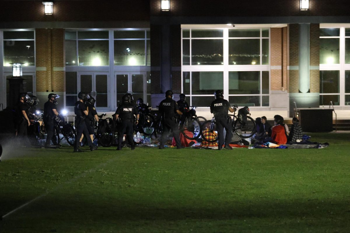 The sprinklers were on as protesters were arrested on Thursday. 