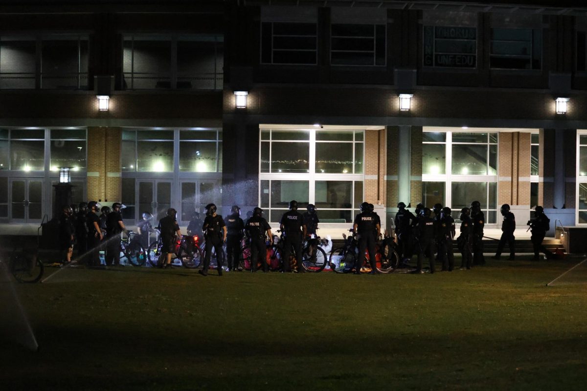The sprinklers were on as protesters were arrested on Thursday. 