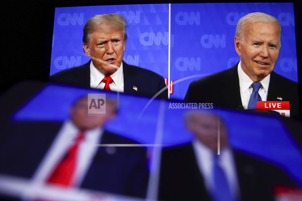 This photo taken from a screen shows the first presidential debate between US President Joe Biden and former President Donald Trump in the CNN studio in Atlanta. The first pre-election debate between current US President Joe Biden and Republican presidential candidate Donald Trump will be held on June 27 without spectators or reporters in the CNN studio in Atlanta. (Photo by Artem Priakhin / SOPA Images/Sipa USA)(Sipa via AP Images)