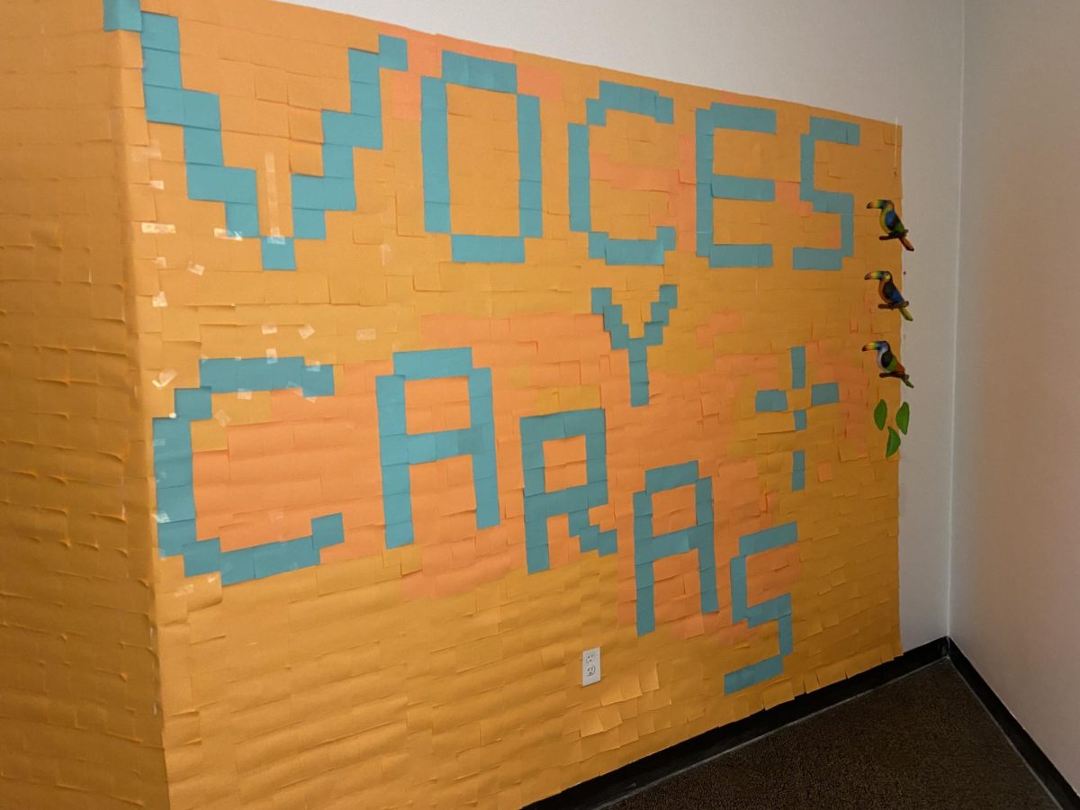 A mural of sticky notes created by Korie ‘Gigi’ Novaton, spelling out “Voces y Caras.”