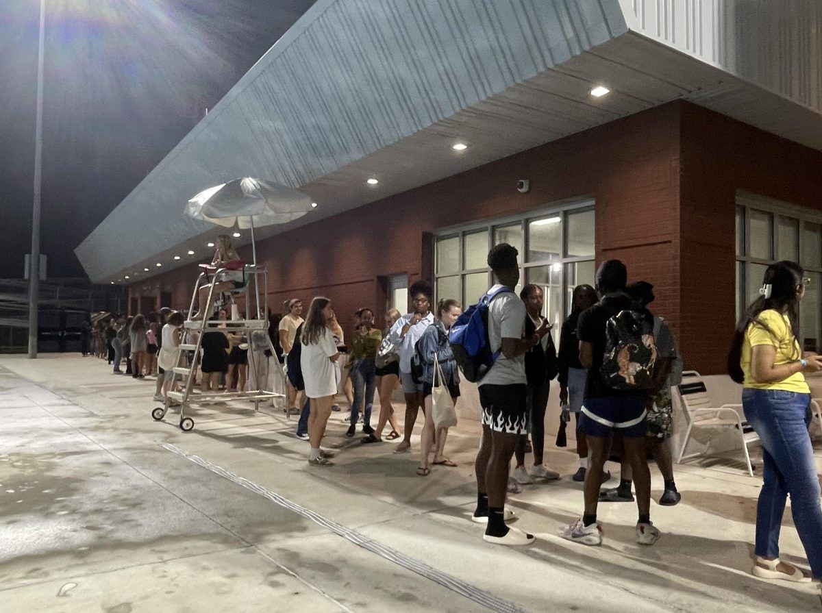 The line of students waiting to receive a custom airbrushed t-shirt