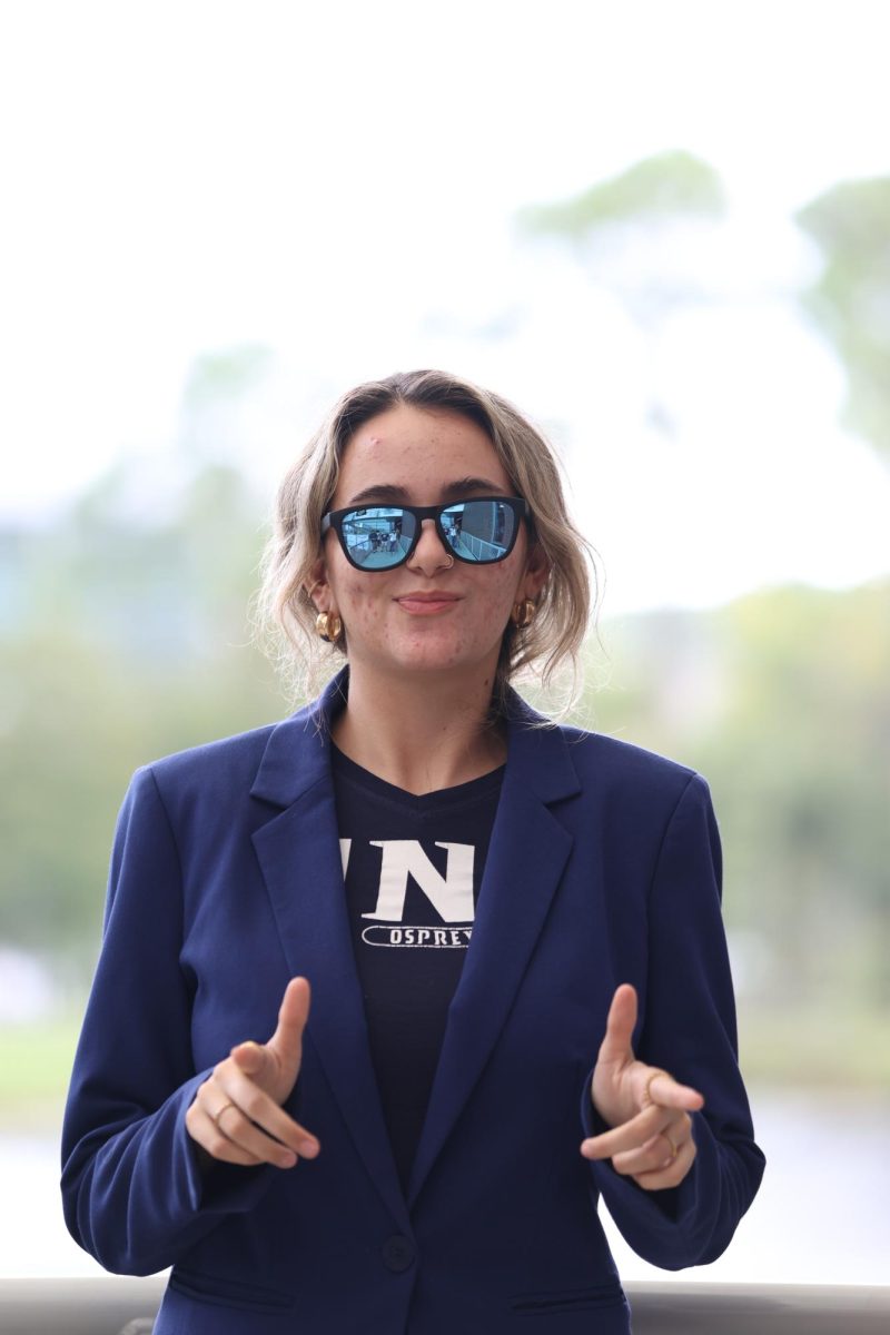 young women in a blue blazer and sunglasses