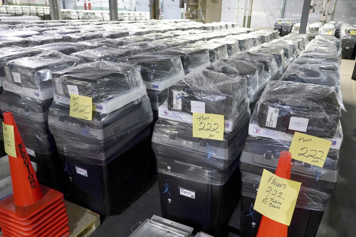 Voting machines are prepared for use on Election Day at the Allegheny County Elections Division warehouse, Wednesday, Oct. 30, 2024, in Pittsburgh. (AP Photo/Matt Freed)