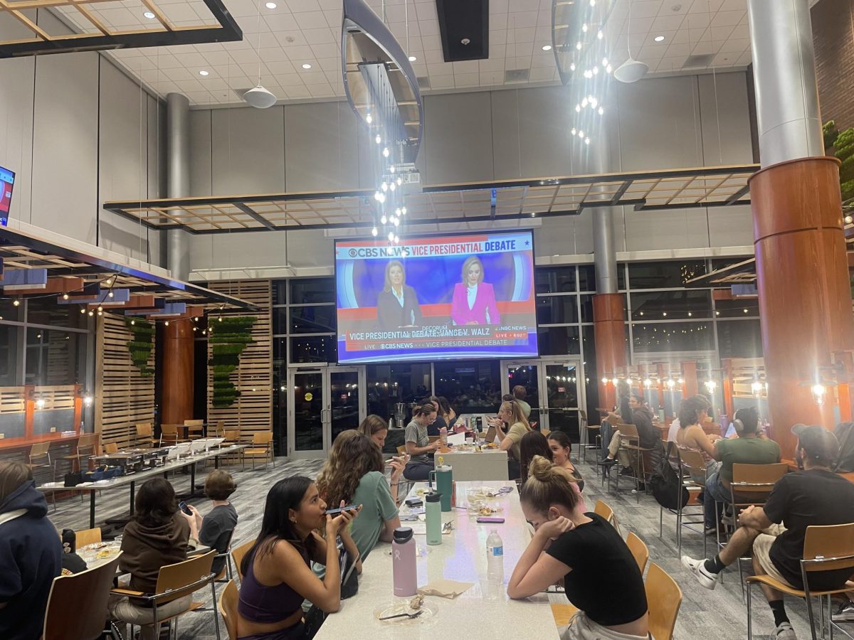 Students enjoy a taco bar and watch the vice presidential debate on Oct. 1 at the Boathouse.