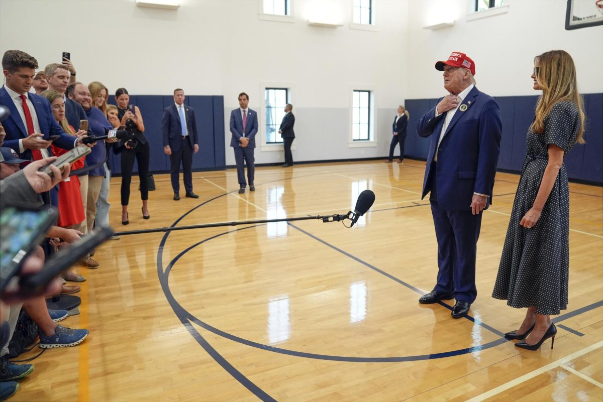 Republican presidential nominee former President Donald Trump speaks as former first lady Melania Trump listens after they voted on Election Day at the Morton and Barbara Mandel Recreation Center, Tuesday, Nov. 5, 2024, in Palm Beach, Fla. (AP Photo/Evan Vucci)