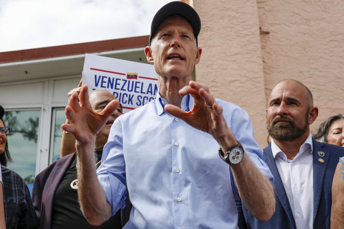 Sen. Rick Scott, R-Fla., speaks to reporters during a get-out-the-vote rally at La Teresita Restaurant on Tuesday, Nov. 5, 2024, in Tampa. (Jefferee Woo/Tampa Bay Times via AP)