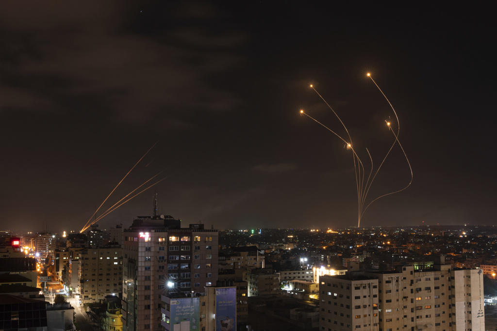 FILE - Rockets fired from Gaza and intercepted by Israel's Iron Dome anti-missile system over Israeli skies are seen from Gaza City, on May 13, 2023. (AP Photo/Fatima Shbair, File)