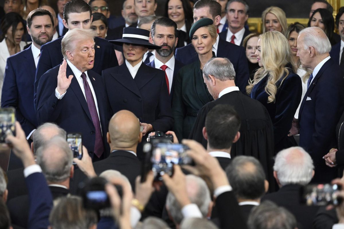 President-elect Donald Trump takes the oath of office during the 60th Presidential Inauguration in the Rotunda of the U.S. Capitol in Washington, Monday, Jan. 20, 2025. (Saul Loeb/Pool photo via AP)