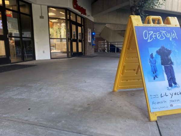 An OzFestival sign outside the UNF Chick-fil-A. 