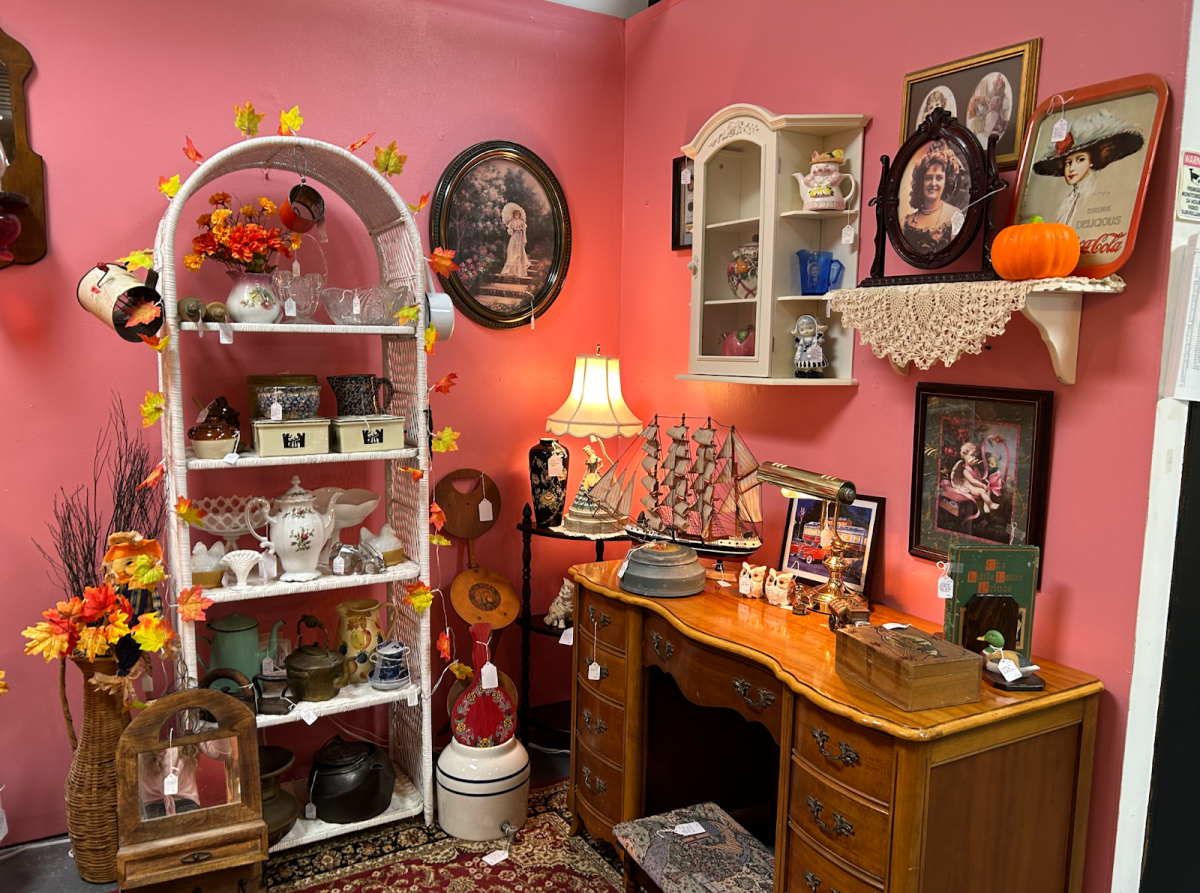 One of the Avonlea vendor's booths with items for sale including teapots, ceramics, furniture and paintings.