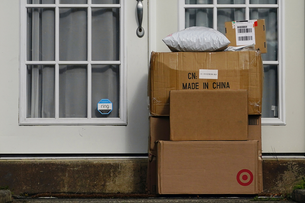 FILE - Packages are seen stacked on the doorstep of a residence, Wednesday, Oct. 27, 2021, in Upper Darby, Pa. (AP Photo/Matt Slocum, File)