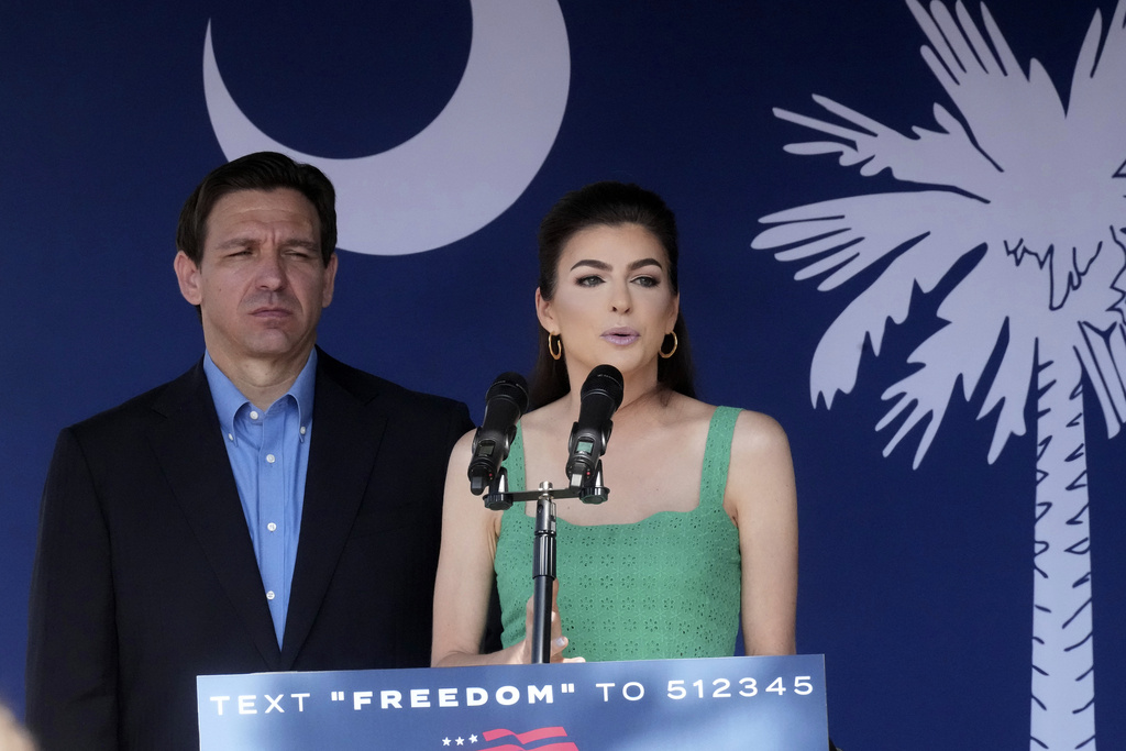 FILE - Florida Gov. Ron DeSantis, left, looks on as his wife Casey DeSantis speaks at a campaign event in Bluffton, S.C., June 2, 2023. (AP Photo/Meg Kinnard, File)