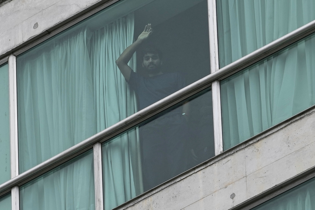 FILE - A migrant deported from the United States stands in a hotel room in Panama City, Feb. 21, 2025. (AP Photo/Matias Delacroix, File)