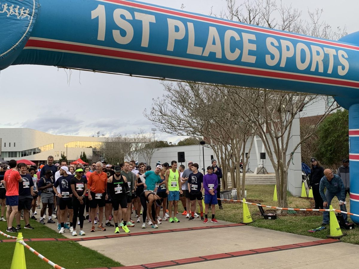 Race participants prepare to run at the starting line of the 5K