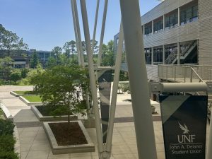 The UNF student union courtyard in between the two metal office buildings