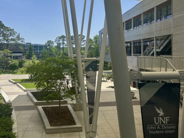 The UNF student union courtyard in between the two metal office buildings