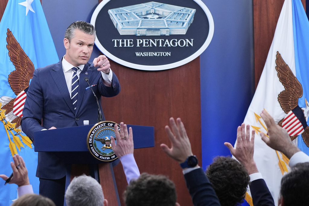 Defense Secretary Pete Hegseth calls on reporters for questions during a news conference at the Pentagon