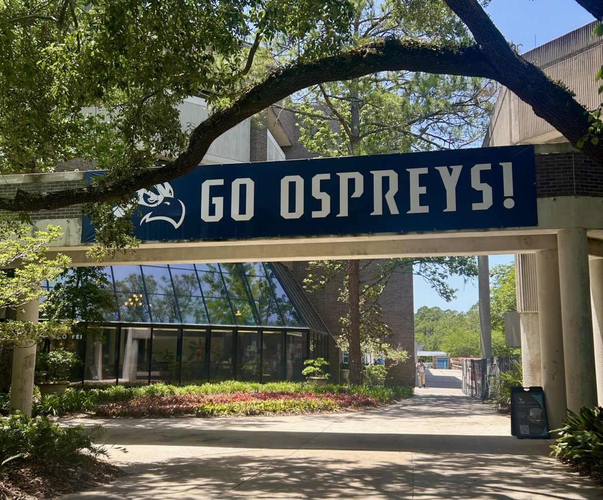 Blue and white “Go Ospreys!” banner outside of Thomas G. Carpenter Library.