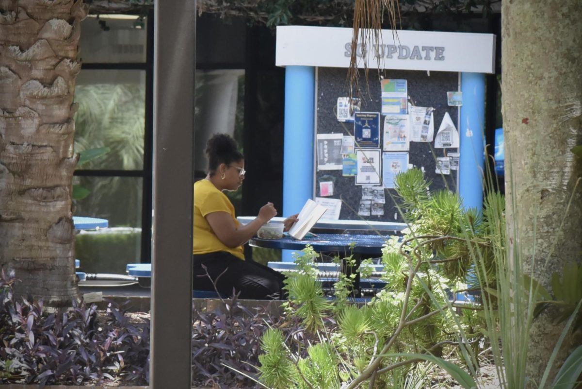 Students sits alone on campus at UNF