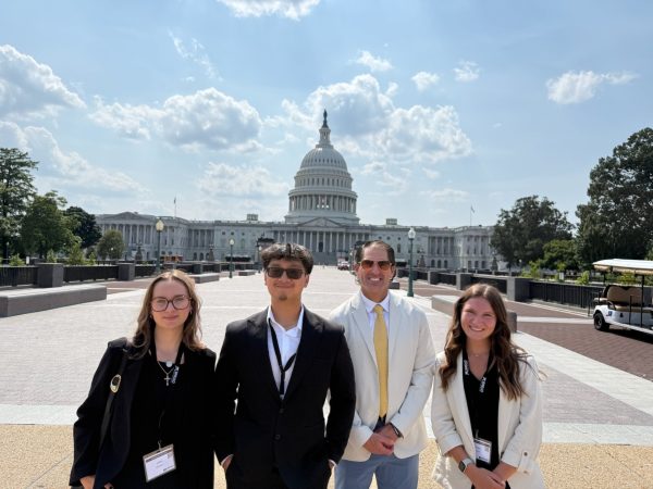 Nourish to Flourish leaders stand in front of the nation's capital left to right: Jillian Groom, James Tra, Dr. Jamie Marchio and Hailey Pond