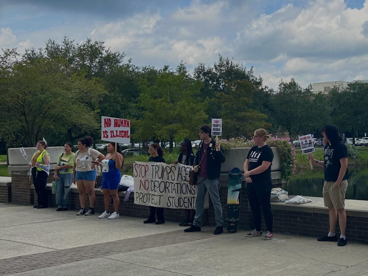 Jacksonville SDS protestors outside of the Library today to protest Ice training on campus.