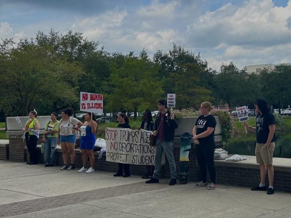Jacksonville SDS protestors outside of the Library today to protest ICE training on campus.