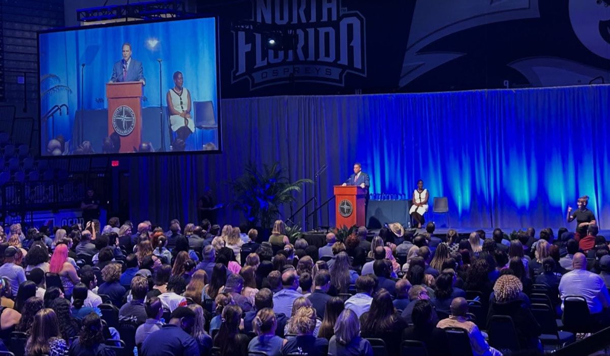 UNF President Moez Limayem speaks at the 2025 Convocation ceremony at UNF Arena