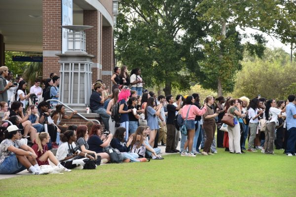 Hundreds of UNF students gather around the UNF Green to watch the performative male contest