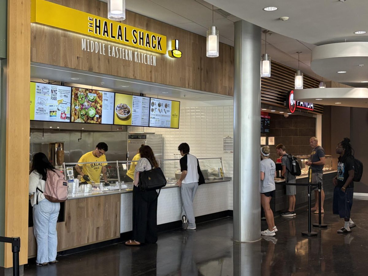 UNF students wait in line to order at The Halal Shack in the student union food court.