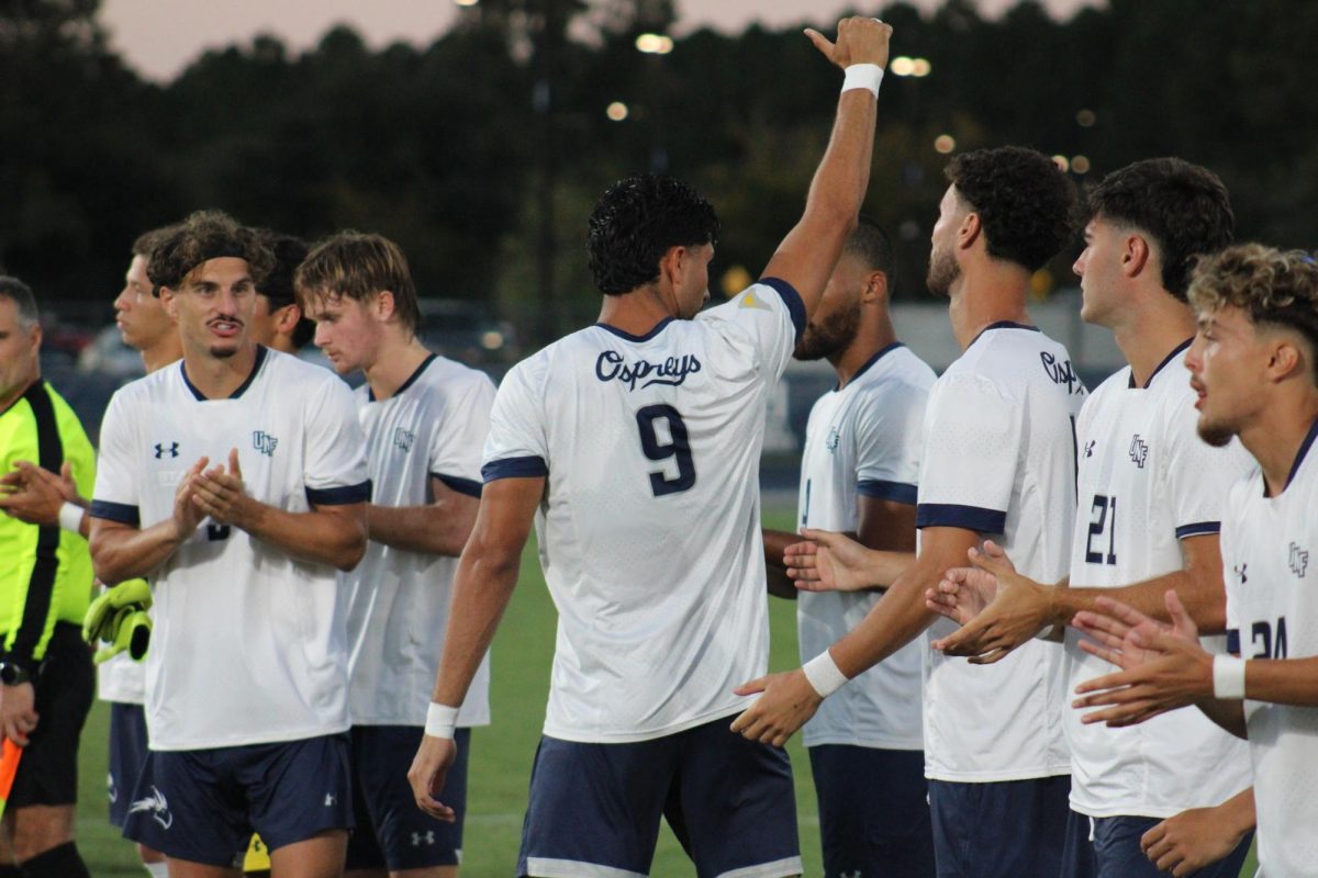 UNF men's soccer players applauded during pregame introductions.