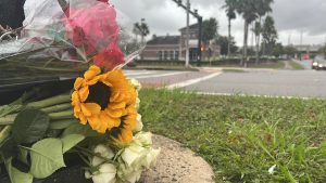 Flowers sit near the site of the motorcycle accident that occurred near UNF campus
