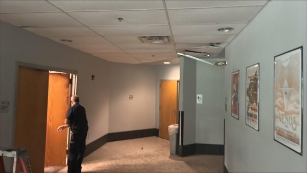 Another photo, taken by a professor who works in building 50, shows damage to the ceiling adjacent to the hallway where the fire happened.